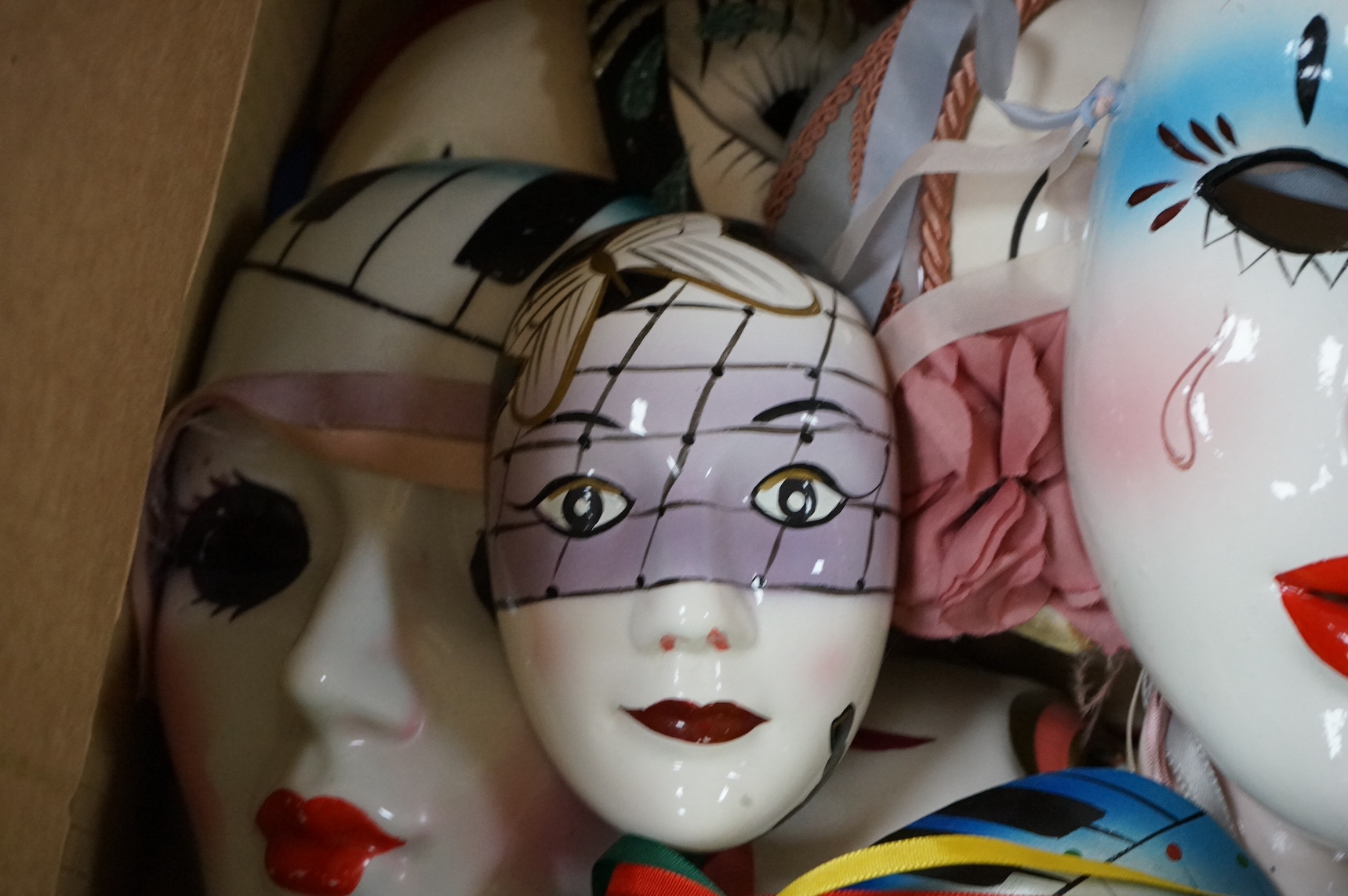 A large collection of various painted wall masks. Condition - varies